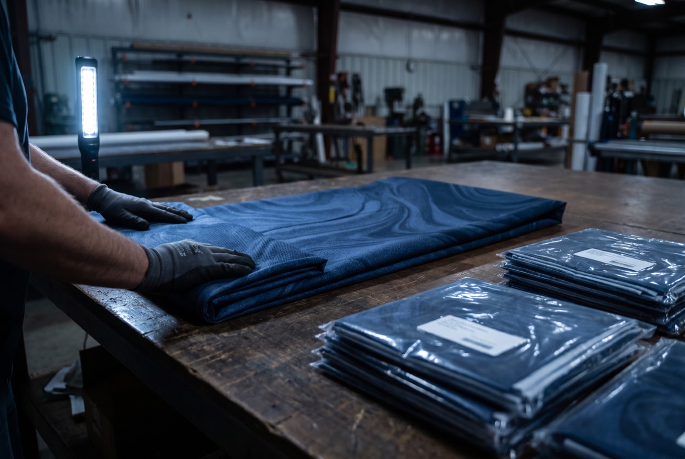 Printed fabric skins folded and sleeved for white-label dispatch